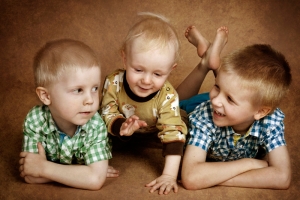 three brothers chatting with brown background