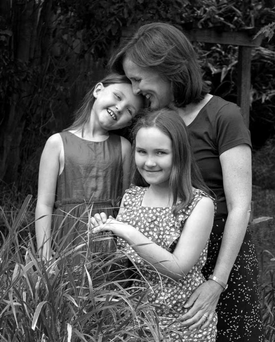 black and white family portrait mother and daughters